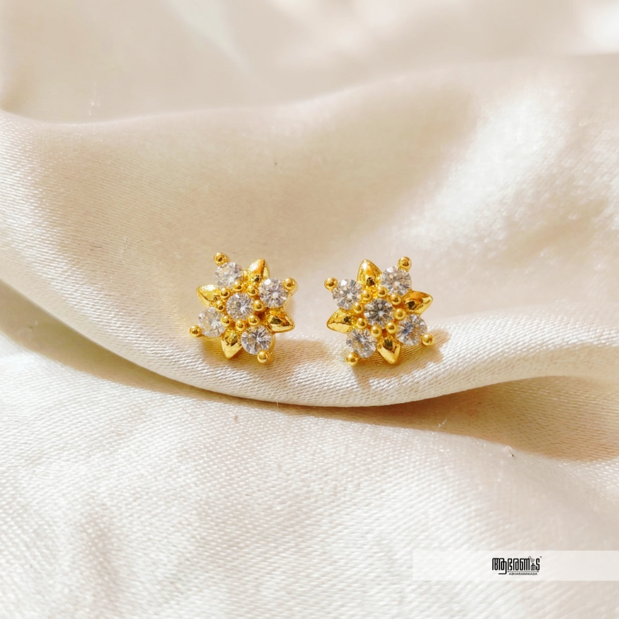 Flower look alike Stone studded Studs