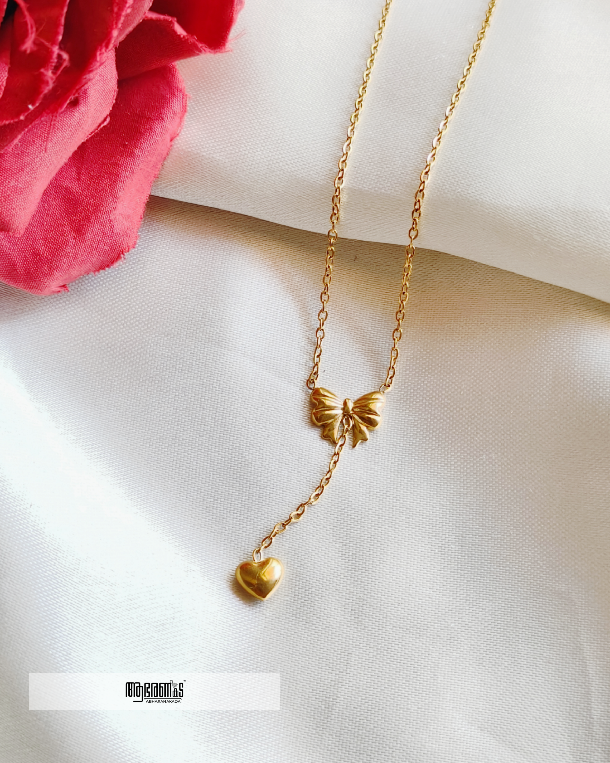 Bow with a hanging heart